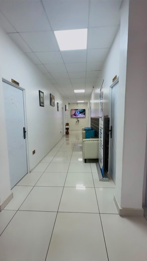 Corridor leading to the consulting and diagnostic rooms at Diplomatic Village Clinic