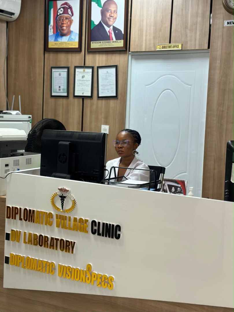 A member of the Diplomatic Village Clinic team at the clinic's front desk